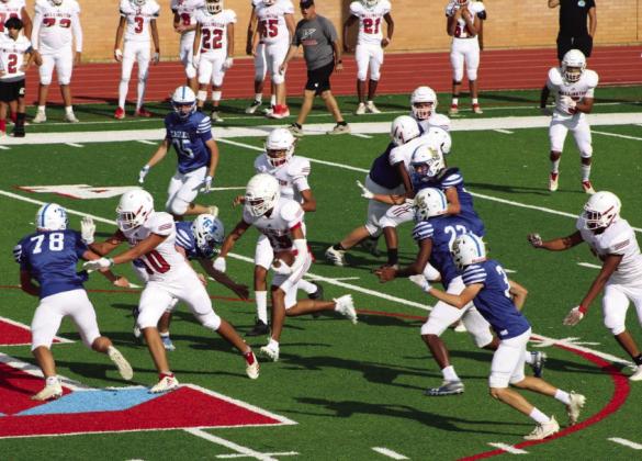 JV Skyrocket ball carrier Anthony Ortiz (15) follows his block down the field as teammates Dalton Holland (52), RJ Granadoz (60), Brenden Garcia (1), Fabian Moreno (65), Jackson Jones (50), Miguel Rincon (5) and Yobani Moreno (77) hold back the Eagles.