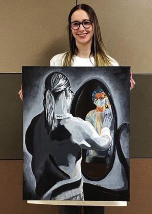 Photos Courtesy of Wellington High School Charlee Bodine, State Qualifier: Becoming - Charlee shows through the colorful reflection in the mirror her excitement about her future. The blackand-