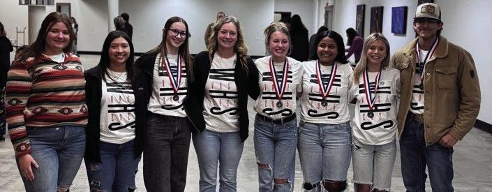 Wellington High School competitors at the Feb. 15 Visual Arts Scholastic Event (VASE) area contest in Amarillo gather with art instructor Marnie Kane following the announcement of the state winners. From left: Jacy Lampe, Jelly Garcia, Charlee Bodine, Kane, Elli Ouellette, Jasmin Moreno, Rilynn Southerland, Damian Needham.