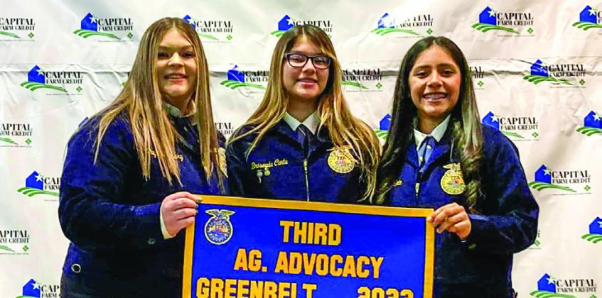 Memphis’s Payton Flannery, Breyseda Cantu, Juliana Soto accept the third-place Agriculture Advocacy banner at the recent Greenbelt District FFA Banquet.
