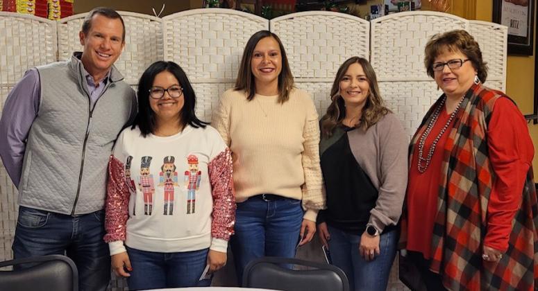 Preferred Management Corporation Vice President Jared Chanski, left, and Collingsworth General Hospital (CGH) Administrator Candy Powell, right, commend Megan Rodriguez, Mary Mayer and Cassandra Torrez for five years of service with CGH. Not pictured: Anna Blades.