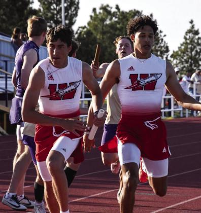 Wellington’s Brenden Garcia hands off to Callen Kane during the Skyrockets’ area championship title at the recent UIL 2A Area 1-2 Championships Wednesday, April 9 at Panther Stadum in Panhandle. Press Pass Sports/Tori Bunch