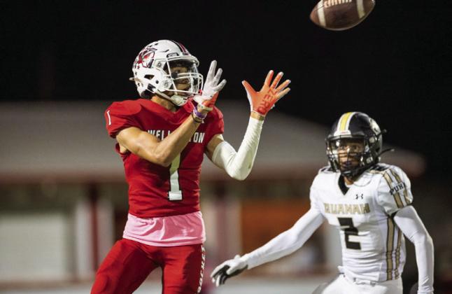 Wellington’s Brenden Garcia (1) hauls in a catch Friday, Oct. 18 at Powell Field in Wellington. Press Pass Sports/Joe Garcia III