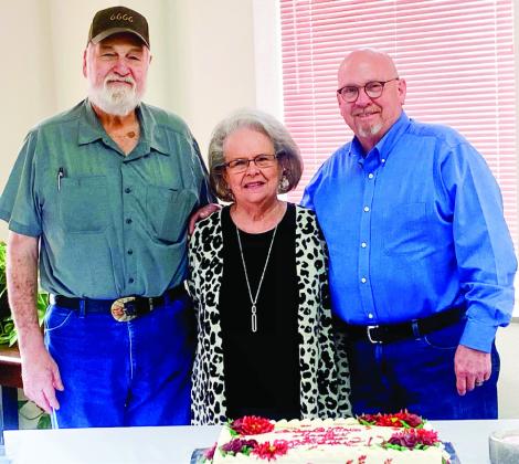 Newly elected Collingsworth County Justice of the Peace Cliff Waller, right, congratulates Deputy Justice of the Peace Marilyn Davis on her retirement following 16 years of service. She is joined by her husband, Eddie Davis.