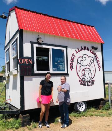 Open 5:30 a.m.-2 p.m. Monday-Friday and 7 a.m.-2 p.m. Sunday, baristas Mallory O’Rear, left, and Abigail Hernandez serve a Sorensen Wellhouse customer a Tiger Pride, an iced coffee signature drink, last Monday afternoon. Also known as The Soggy Llama, watch for the bright, red tin roof on the west side of U.S. Hwy 83. Coffee orders can be called in to the temporary number, 806-676-2644.