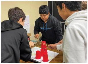 Austin Elementary School and Memphis Middle School Gifted and Talented (GT) students partake in recent meeting activities, including completing the Cup Stack Challenge, in which students worked together using one rubber band and four pieces of string to stack six cups, and playing human tic-tac-toe. Photos Courtesy of Memphis ISD