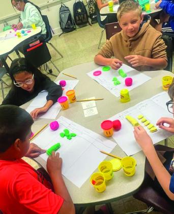 Austin Elementary fifth-grade students explore place value using playdough Friday, Aug. 19. Photos Courtesy of Memphis ISD