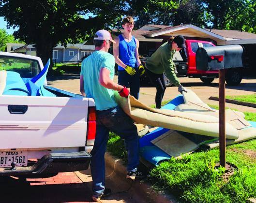 Volunteers of all ages and walks of life volunteer for the 2025 Wellington City Wide Clean-Up Saturday, May 3, hauling loads and loads of debris, tree branches, old furniture and appliances and trash to the city landfill Karen Caldwell