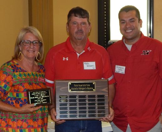 Wade Williams accepts the 2023 Rocket House Wall of Honor merit from Renee Hanna, left, and Jermaine Cantu. The Red River Sun/Bev Odom