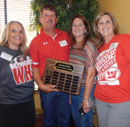 Siblings Amy Williams Estes, left, and Ashley Long Williams, right, gather with Wade and Diann Williams following the announcement of his Rocket House Wall of Honor distinction.