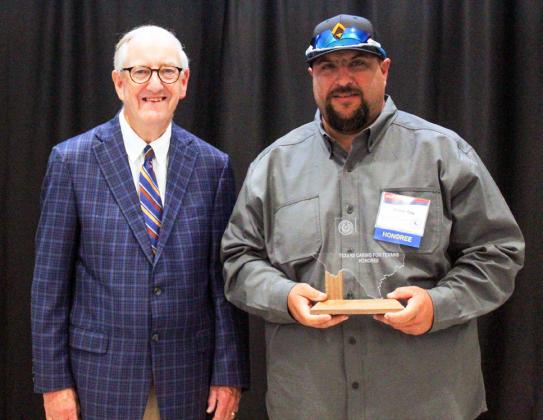 Texas Department of Transportation (TxDOT) Childress County General Transportation Technician Trevor Ray, right, with Texas Rep. John Smithee at the 28th Annual Texans Caring for Texans award ceremony. At the ceremony, Ray was recognized for going above and beyond for the Childress District.