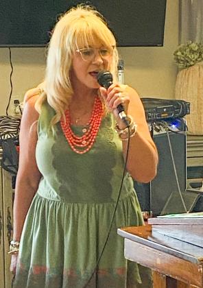 Melissa Kiker brings praise music to Wellington Care Center with her music ministry Sunday, Aug. 20. She commented that she and the Lord brought 14 songs to six residents and a guest, Sandy Sain. “It was such a blessing today,” Kiker said. Her husband, Lon Kiker, helped her load the music. Courtesy Photo