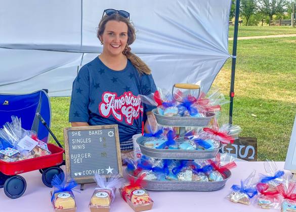 She Bakes Cookies and Cakes, LLC’s Shelby Parr sets up a booth at the 2022 Fourth of July Party in the Park Event. This year, the event, which will welcome over 30 vendors, will take place from 5-9 p.m. Tuesday, July 4 in Fair Park. Photo by Shelby Bocanegra