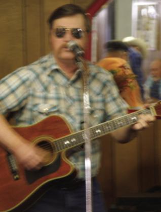 Jeff Pastor, of Wellington, performs hymns at the annual Thanksgiving Luncheon Thursday, Nov. 16 at the Childress Senior Citizens Center. In addition to self-accompaniment, his selections featured two of his own songs, “Hold On” and “There’s Room At The Altar.” Pastsor, a disabled veteran, serves as the chaplain for the Glynn Moore Veterans of Foreign Wars (VFW) Post 6439. His wife, Alice Pastor, was among the approximant 100 individuals at the luncheon. Photo by Grace Holman