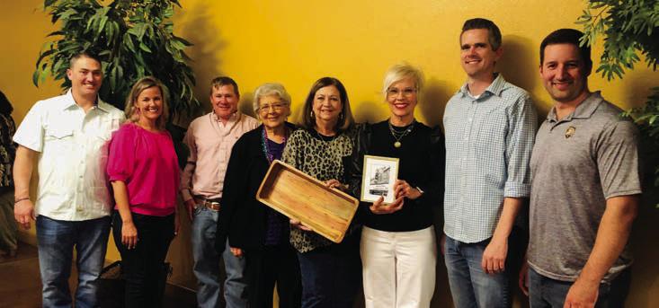 Wellington Ritz Theatre Board of Directors honor outgoing President Margret Wood with a gift of gratefulness during the Mardi Gras Meal and Bingo 2023, an event to thank sustaining members for their support, at 6:30 p.m. Thursday, Feb. 23. Wood served as president from 2016 until October 2022, when Lyndy Forrester-Black assumed the role as board president. From left: Luke and Amy Inman, Taylor Allred, Katherine Reeves, Wood, Forrester-Black, Kenny Keys, Ethan Cole. The Red River Sun/Bev Odom
