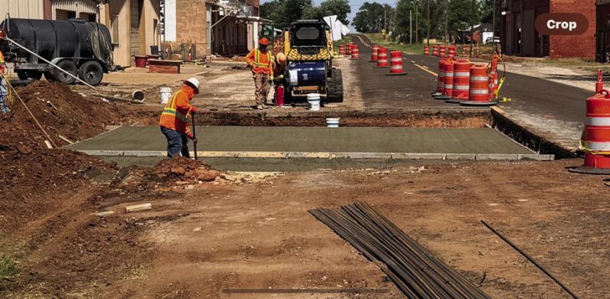 Entering Dodson from Wellington, contractors pour the 15-inch cement base in the westbound lane of a lower elevation portion of FM 338.