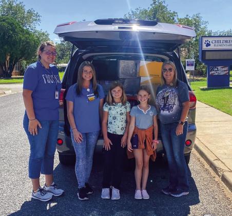 Walmart’s Misty Willis and Jordan Farus donate school supplies to Childress Elementary School Friday, Sept. 2. From left, Childress Elementary School Vice Principal Shelby Morris, Farus, Childress Elementary School students Brooklyn Gillem and Hailey Thomas and Willis. Photo Courtesy of Walmart