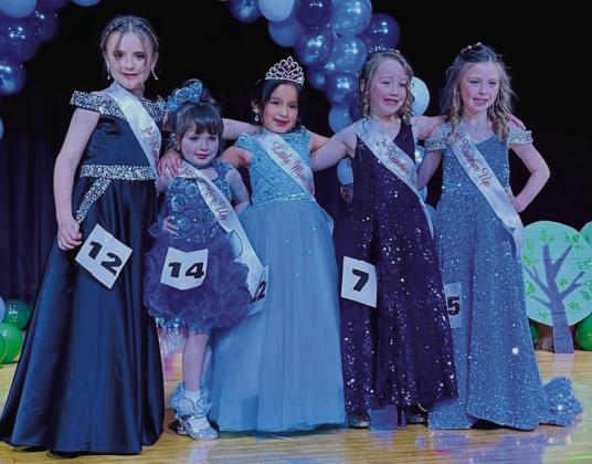 Little Miss Wellington 2025 Salma Tellez, center, embraces third runner-up JoLee Breedlove, left, first runner-up Stassi Jeffrey, second runner-up Saige Coyne and fourth runner-up Brynlee Holton.