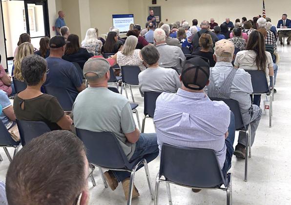 Residents listen to a Lancium representative discuss a plan to bring new water to the Greenbelt system Tuesday. INTREPID PHOTO / AARON RAMOS