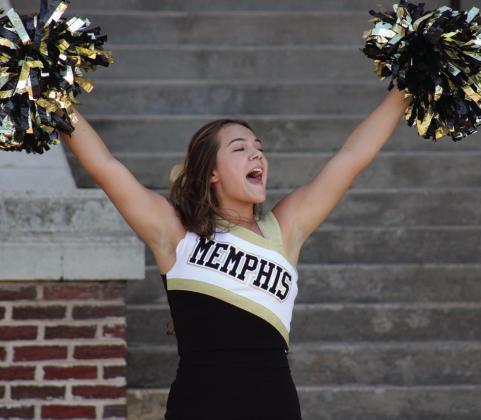 Cyclone cheerleader Macaela Graham performs an opening cheer during Meet the Cyclones Monday, Aug. 16.