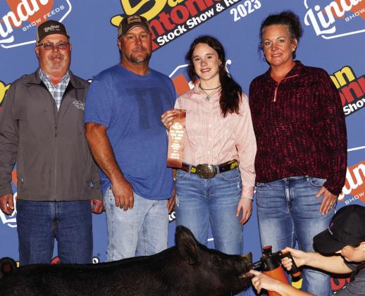 Wellington High School freshman Kenady Skelton places ninth with her cross swine at the San Antonio Stock Show and Rodeo Wednesday, Feb. 8. From left: David Newbrough, Chad Skelton, Kenady Skelton, Carrie Skelton.