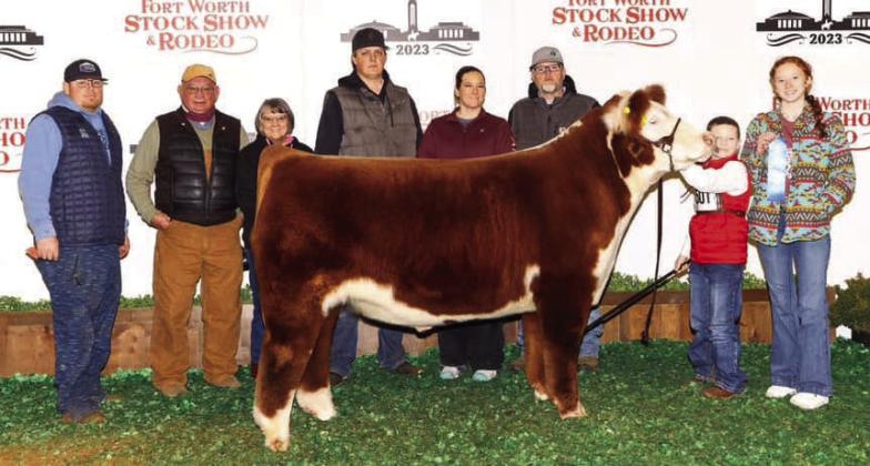 Wellington Elementary School third-grader Jacob Page earns first place with his middle weight Hereford steer “Hank” at the recent Fort Worth Stock Show and Rodeo. From left: Trevor Rosso, Kelly Gaskins, Teresa Gaskins, Connor Cross, Katie Page, Jeremy Page, Jacob Page, Bailey Page.