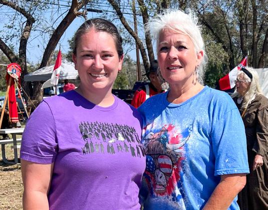 Claiming second place in the Living History Ice Cream Freeze-Off, Samantha Bohannon, left, entered her creamy chocolate ice cream, while first prize winner Debbie Huntress prepared her vanilla peach ice cream.