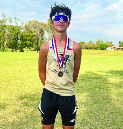 Memphis’ Kyler Robison caps a fifth-place finish at the recent UIL District 2 Meet in Wheeler, advancing to the UIL Region 1 Cross Country Championships.
