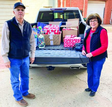 Childress County Christmas Sharing’s Melvin and Sarah Long deliver gifts to Childress Healthcare Center and Cottage Village Assisted Living Facility just in time for the holiday season. Photos Courtesy of Childress County Christmas Sharing