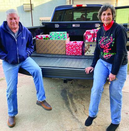 Childress County Christmas Sharing’s Jim and Raenell Smith deliver gifts to Childress Healthcare Center and Cottage Village Assisted Living Facility residents. “We wish a Merry Christmas to the residents and caregivers,” Raenell said.