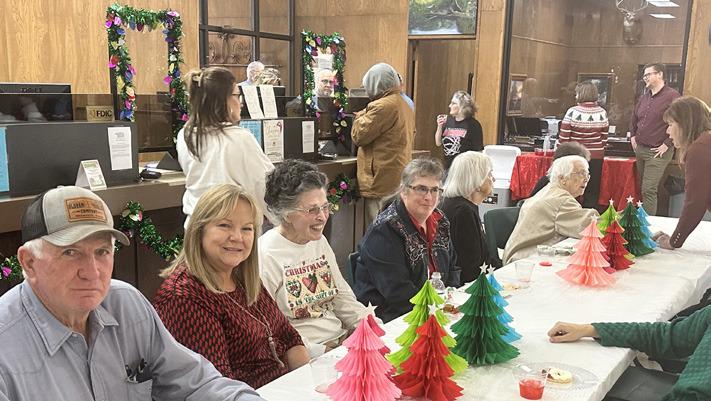 Entertained by Gerald Monson Music pianists, vocalists and instrumentalists, the Collingsworth County community revels in the food and fellowship at Wellington State Bank’s Christmas Open House from 11 a.m.-2 p.m. Thursday, Dec. 7. Photos by Debbie Huntress