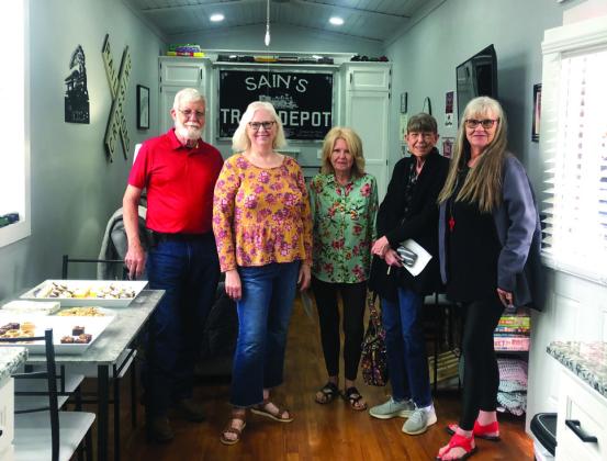 Oran and Karon Sain give a guided tour of The Boxcar to visitors Patsy Tipton Dodge, Nancy Tipton-Ellis and Doris Wilbur.