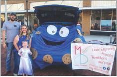 MD Custom Creations owners Eric and Jazmine Morton, assisted by Lexi, win the Trunk-or-Treat Business Category with a Cookie Monster theme. Trick-or-treaters came out in droves as Wellington Professional Women’s Club handed out 300 bags of cotton candy. Courtesy Photo
