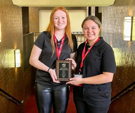 Jillian Pierce, Emma Britten and Adlee Lambert (not pictured) take silver in Chapter Service Display Level 2 to qualify for the State Leadership Conference.