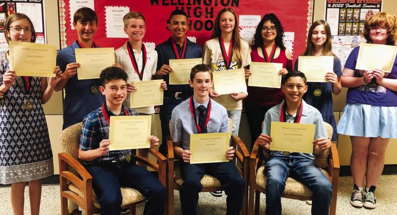 Seventh-grade students accept Top 10 awards. Front row, from left: first, Jaxon Collins; second, Kyler Keys; third, Leo Granadoz. Back row, from left: fourth, Natalee Hudson; fifth, Lawson Inman; sixth, Jax Heflin; seventh, Alex Orozco; seventh, Maci Brewer; eighth, Natalee Alvarado; 10th, tie, Anna Henard and Rosalind Stiles.