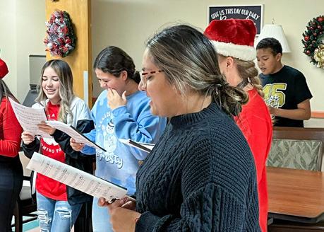 Memphis Middle School M5 students recently Christmas carol at Memphis Convalescent Center. Additionally, Memphis High School juniors and seniors made holiday cards for nursing home residents. Photos Courtesy of Memphis ISD
