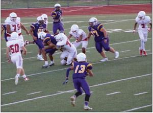 Junior varsity Skyrocket Yobani Moreno (77) takes down a Wildcat, while Nick Nevarez (79), Jackson Jones (50), DeMarcus Lewis (3) and a host of Rockets come to back him up Thursday, Sept. 8 at home. The junior varsity Rockets traveled to Panhandle Thursday, Sept. 22. The Red River Sun/Shauna Salinas