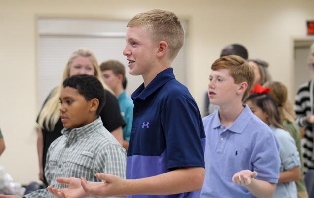 Childress County 4-H members recite the 4-H pledge at the 2022-2023 Year-End Awards Banquet Tuesday, Aug. 22 at the Fair Park City Auditorium. From left: Bryson Session, Sterling Bruce, Ryker Schaefer. The Red River Sun/Elizabeth Tanner