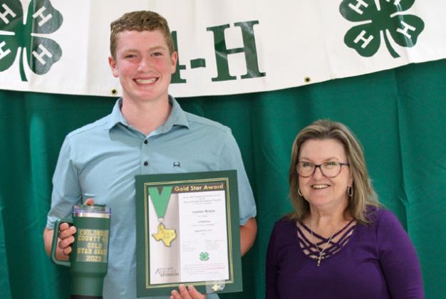 Cutter Bruce receives the Gold Star award from Childress County AgriLife Extension Service Secretary Ann Ricks. Bruce was involved in Bee Keeping, Essay Contest, Beef Poster, Exhibit Board, Livestock Judging, Meat Judging, Photography, Teen Leader Lab, Penned Cattle, Lamb, County Horse Club Events, Entomology and State Record Book.