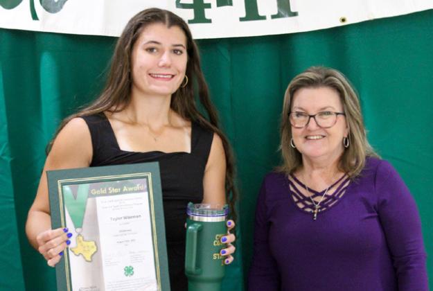 Taylor Wiseman receives the Gold Star award from Childress County AgriLife Extension Service Secretary Ann Ricks. Wiseman was involved in Ag Product Identification, Fashion and Interior Design, Food and Nutrition, Photography, Record Book, Goat, Poultry and Trap.