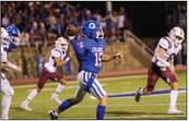 Childress quarterback Drake Rabe (15) looks for running back Da’Reon Mathis during the Bobcats’ 41-13 win over the Bowie Jackrabbits Friday, Sept. 22 at Fair Park Stadium.