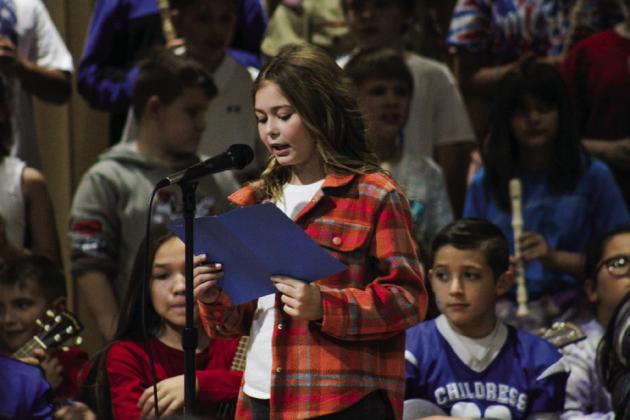 Childress Elementary fifth-grader Brittan Bocanegra opens the Veterans Day Program, hosted Friday, Nov. 11 in the Childress Elementary School gymnasium.