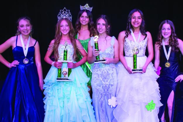 Wellington Junior High School eighth-grader Hazel Estrada, second from right, garners third place and Most Photogenic in the Preteen division of the 78th Annual Shamrock St. Patrick’s Day Celebration Lad n’ Lassie Pageant Sunday, March 16 on the Shamrock High School stage. Additional winners include, from left, Ashlynn Lee, Best Smile; Ashlynn Franklin, first place; Finley Nevarez, second place; and Zoey Billingsley, Best Casual Wear. Miss Irish Rose 2025 Taylor Sullivan, back, presented the honors.