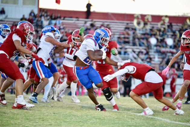 Childress running back Lucian Davis stiff arms a Friona defender during the Bobcats’ 52-0 district opening shutout Friday, Oct. 10 at Chieftain Stadium in Friona. Press Pass Sports/Lori Rabe