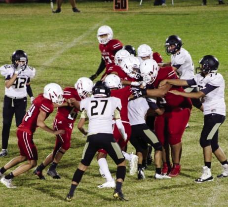 A host of junior varsity Skyrockets, including DeMarcus Lewis (3), Armando Hinojosa (73), Noah Cantu (4), Trenton Wright (55), KJ Molina (64), Travis Tillman (44), Nick Nevarez (79), Brenden Garcia (1), Anthony Ortiz (15) and Dalton Holland (52), stop the Mustangs in their tracks. Wellington remains undefeated on the season (7-0), shutting out Wheeler 44-0. The Red River Sun/Shauna Salinas
