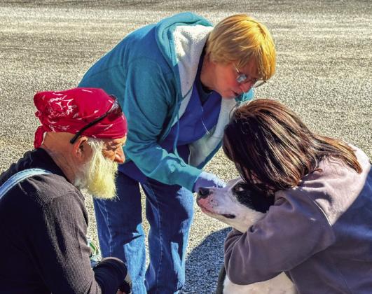 Volunteers vaccinate over 200 pets at the recent free rabies vaccination clinic Saturday, Nov. 9 at the Fair Park Pavillion. Courtesy Photos