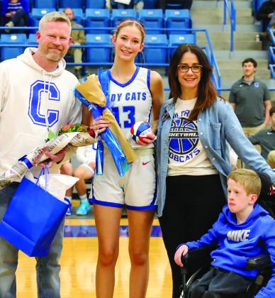Childress Lady Cat basketball player Adah Henderson with brother Noah Henderson and parents Jacob and Amanda Henderson