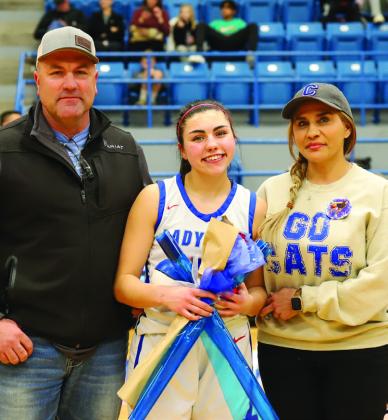 Childress Lady Cat basketball player Aspen Lomax with parents Coby and Dora Lomax.