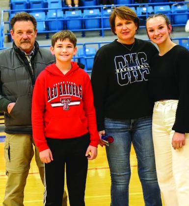 Childress Lady Cat basketball manager Jena Preston with brother Jered Preston and parents John and Shelly Preston.