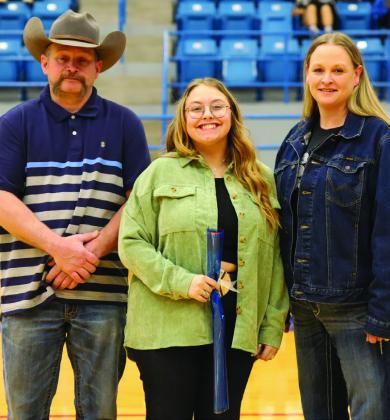 Childress Lady Cat basketball manager Faith Seitz with parents AC and Kari Bailey.